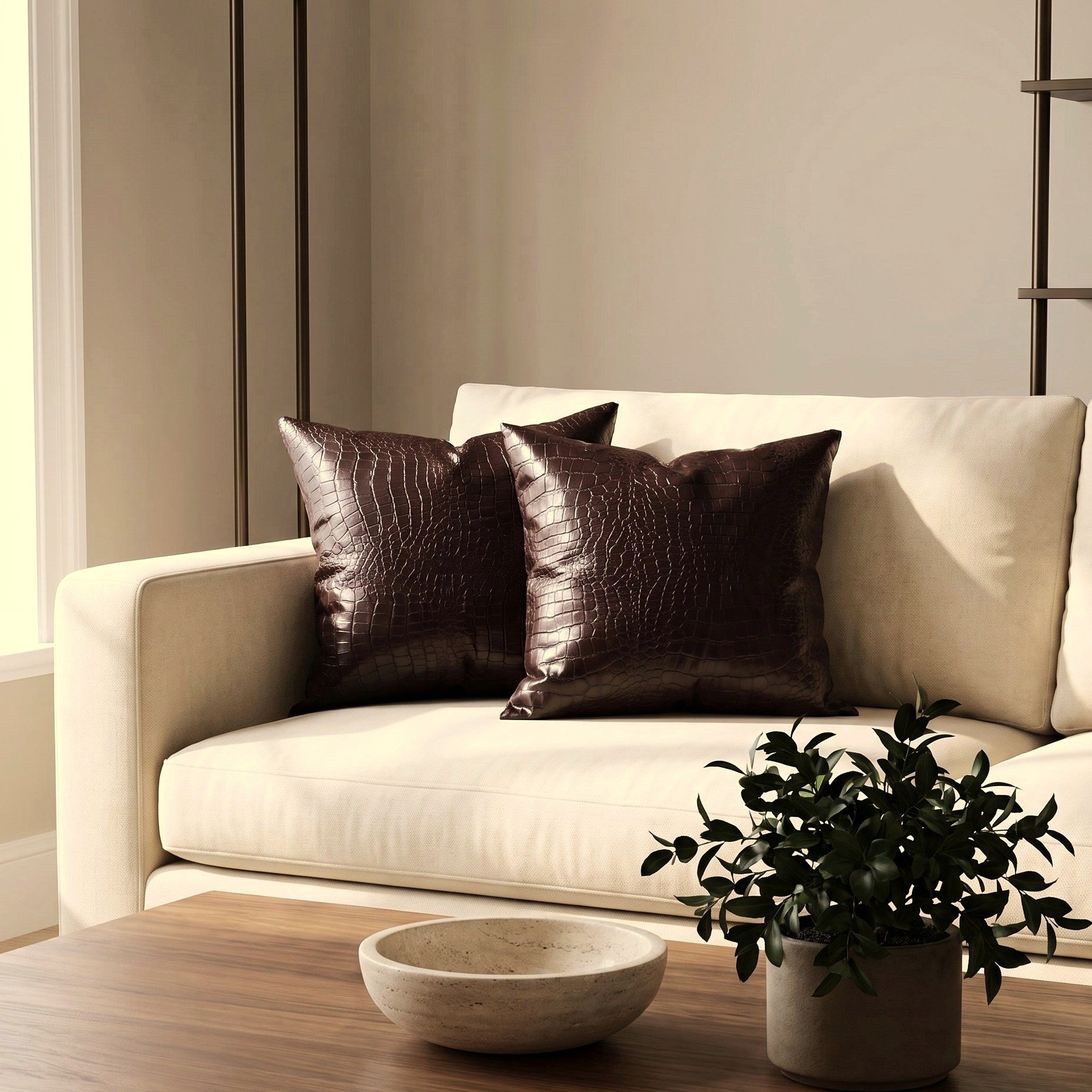 Croc Espresso pillow covers styled on a warm ivory sofa