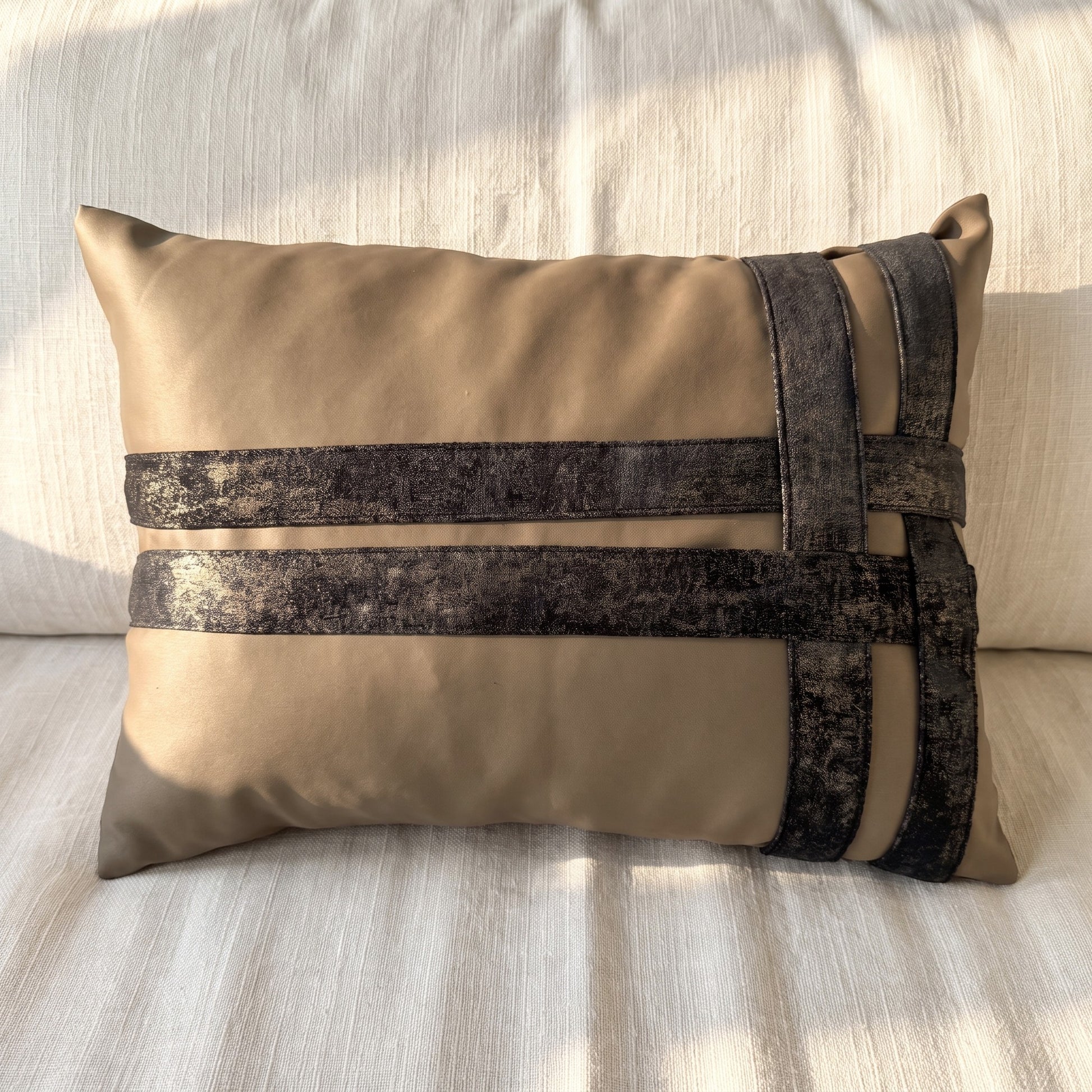 Taupe velvet lumbar pillow cover with intersecting dark printed velvet bands arranged in an asymmetric geometric pattern.
