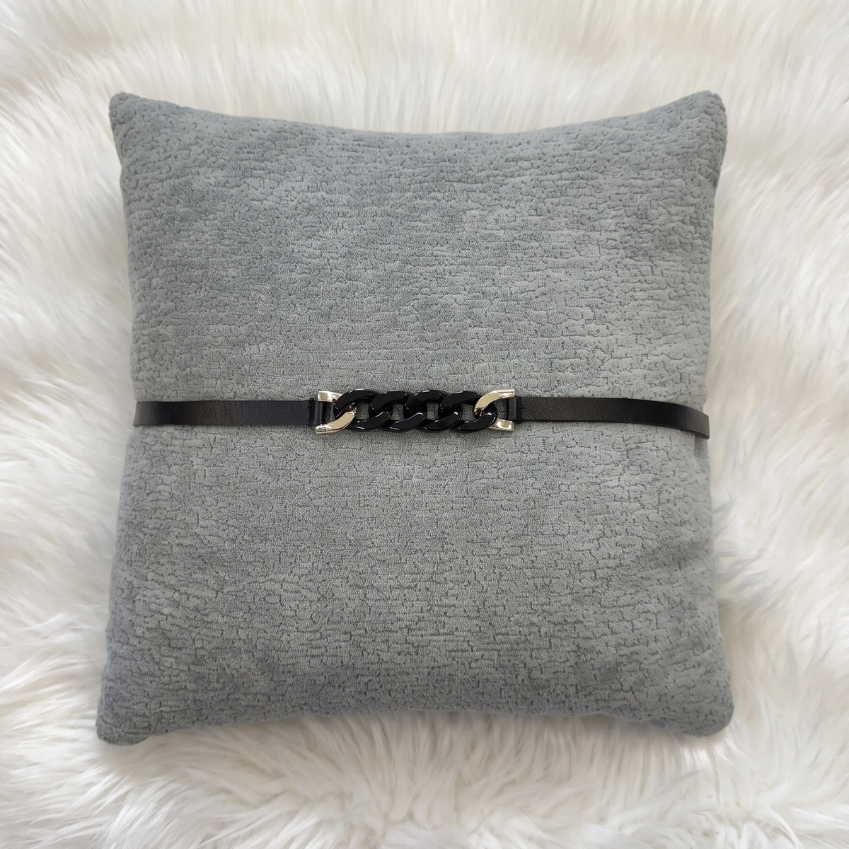 gray Dominion gray chenille square pillow cover with black strap and chain detailing