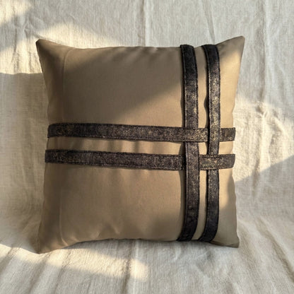 Square taupe velvet pillow cover with contrasting dark printed velvet bands creating a structured geometric design.
