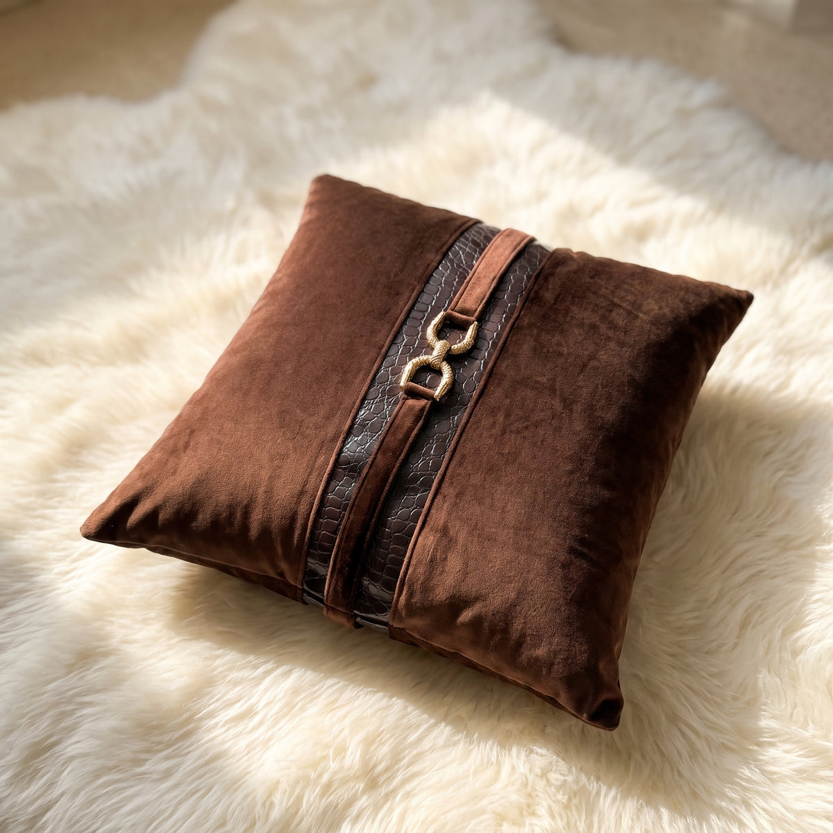 Angled view of Mocha Crest velvet lumbar pillow cover with croc-embossed detailing