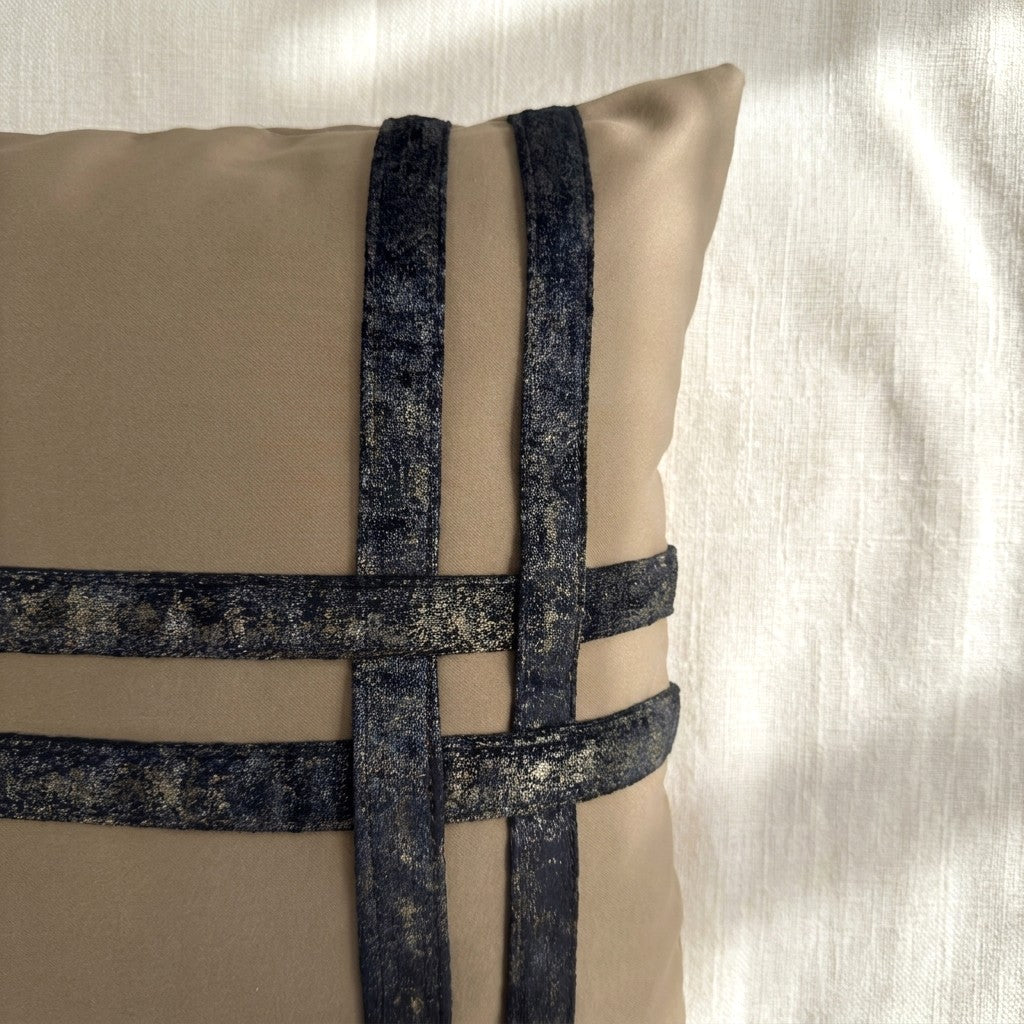Close-up of dark bronze-toned printed velvet bands stitched over soft taupe velvet, showing the contrasting textures and pattern.