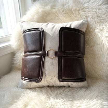 Ivory Belmont square pillow cover with dark brown faux-leather panels and gold-tone ring detail