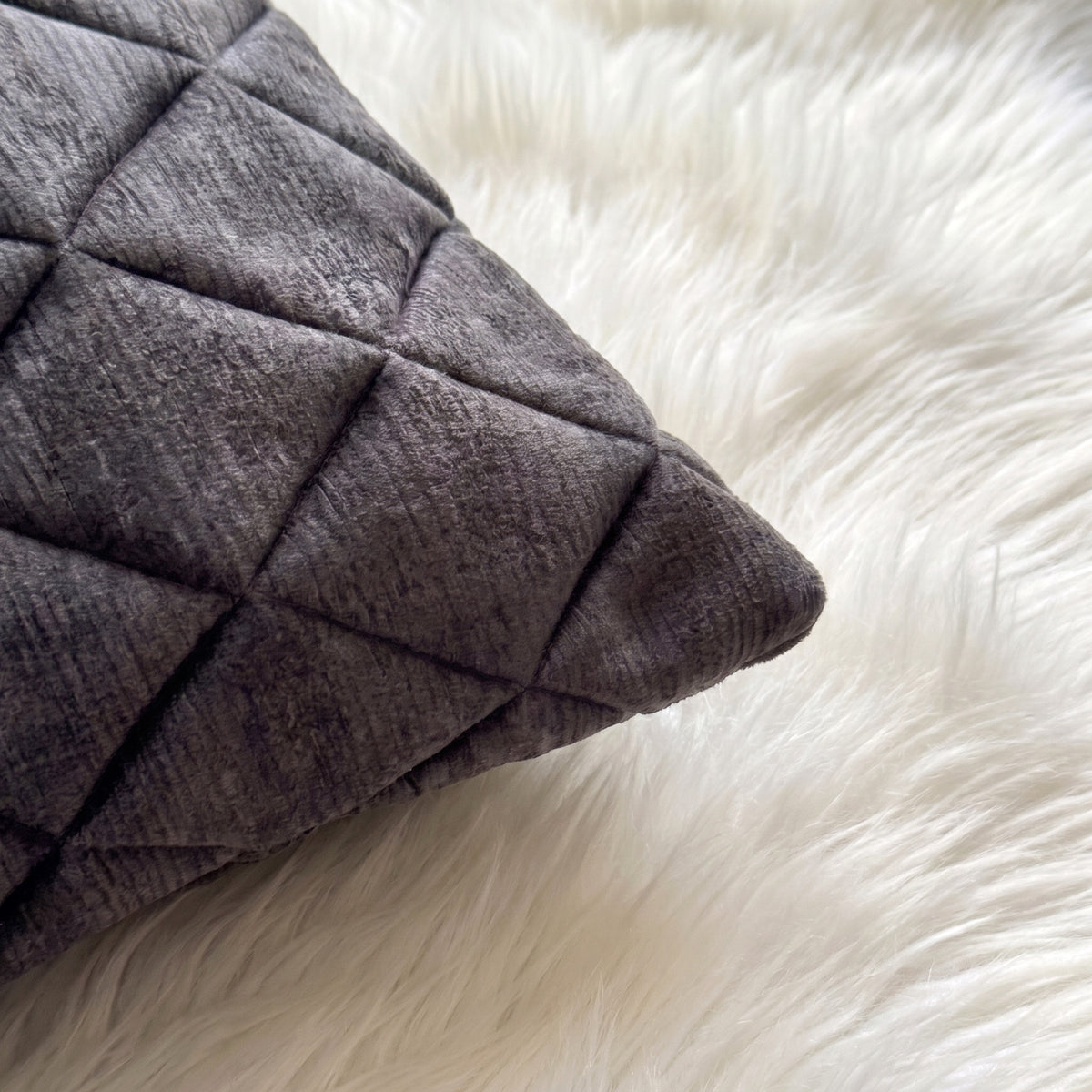 Close-up of Graphite Mirage dimensional diamond-quilted fabric texture