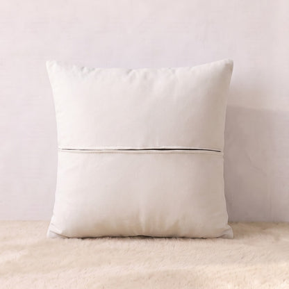 Back view of an ivory velvet pillow cover showing the plain velvet reverse and zipper closure.
