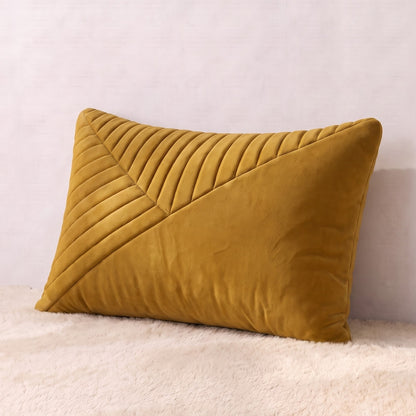 Mustard-gold velvet lumbar pillow cover with structured pleated detailing across the front.