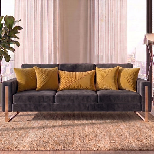 Velvet Vertex cushion cover set styled on a deep charcoal sofa