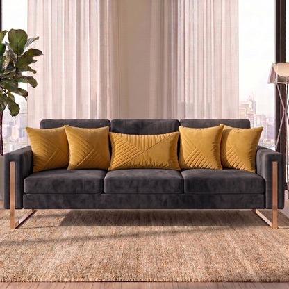 Velvet Vertex cushion cover set styled on a deep charcoal sofa