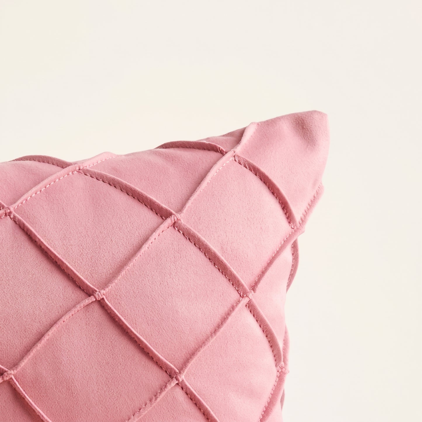 Close-up of Diamond Royale pink fabric, detailing and stitching