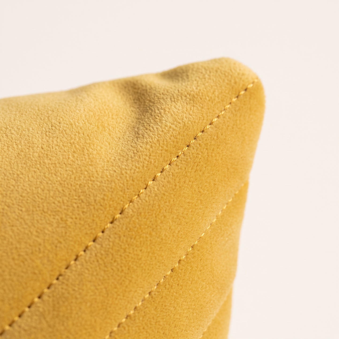 Close-up of Velvet Vertex velvet texture, geometric folds and stitching