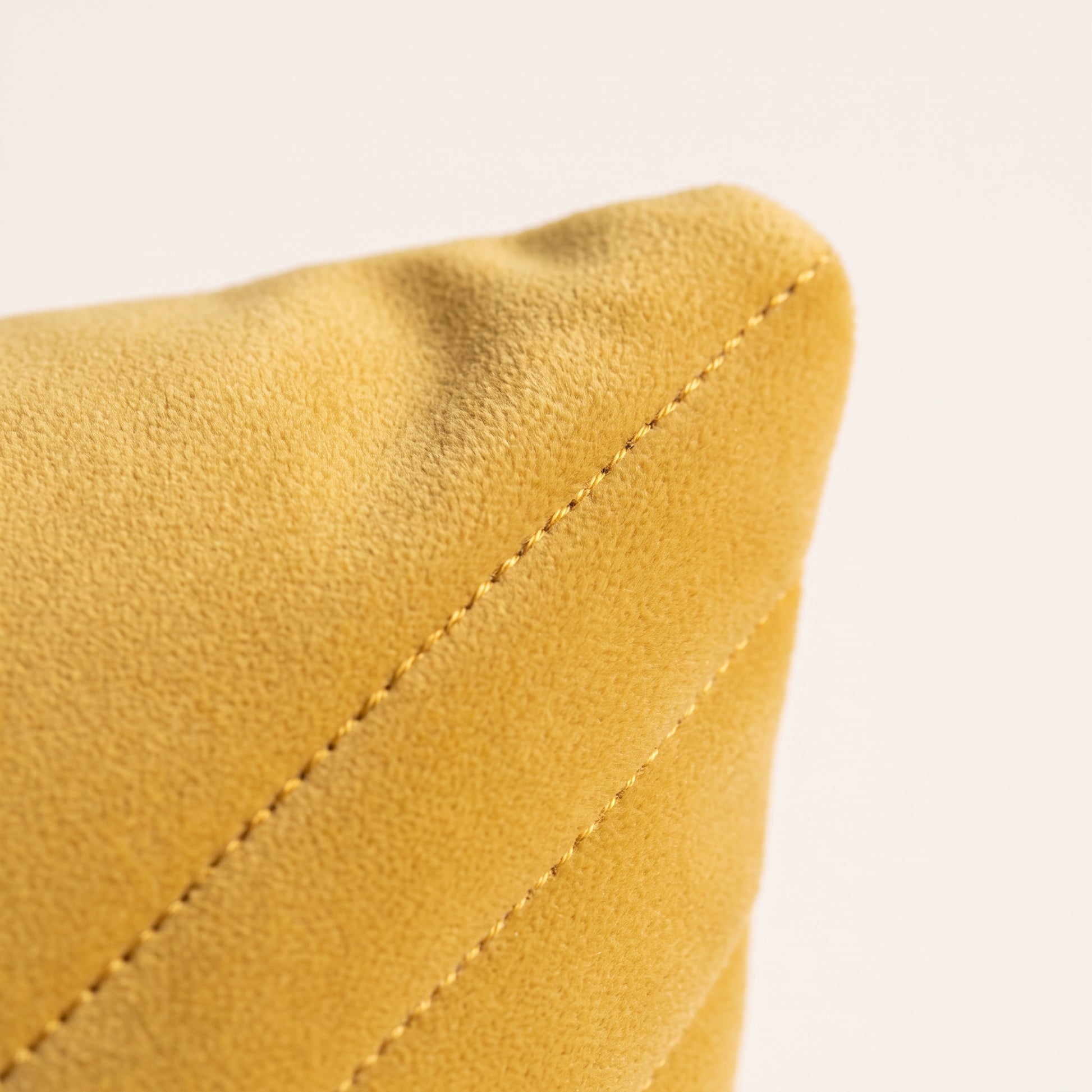 Close-up of Velvet Vertex velvet texture, geometric folds and stitching