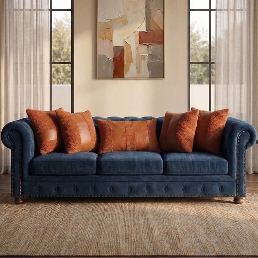 Rustic Amber cushion cover set styled on a dark navy sofa
