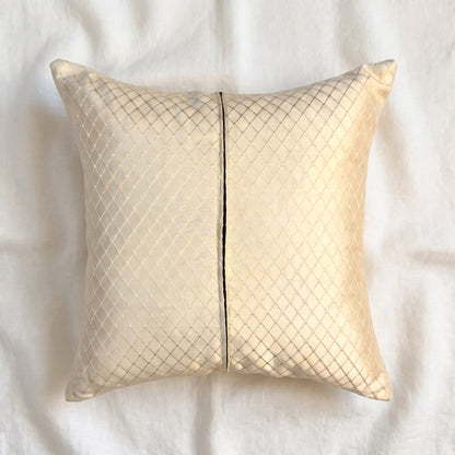 Back view of a champagne-gold jacquard pillow cover showing matching fabric on the reverse and the zipper closure.
